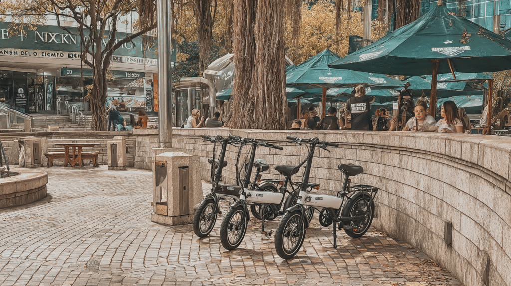 electric folding bikes johnkrechting Folding Ebikes parked outside a shopping center 45d8a712 a249 4e1f 8227 78e41cb9c1fc 3